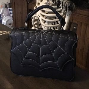 Black spider web hand bag